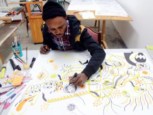 Artist Karo Akpokiere at work.