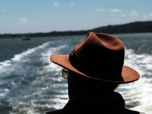 NEW YORK, NY - MAY 16: A man looks out at New York Harbor while on the Staten Island Ferry on a blustery spring day in Manhattan on May 16, 2016 in New York, New York. New York has been experiencing cool and windy weather over the past few days with gradual warming expected throughout the week.
