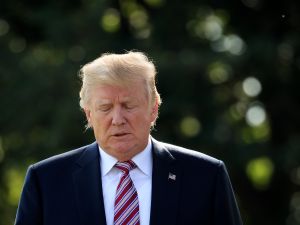 President Donald Trump walks toward reporters before boarding Marine One on the South Lawn of the White House, September 29, 2017 in Washington, D.C.