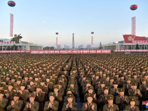 This picture released by North Korea's official Korean Central News Agency shows North Korean soldiers and Pyongyang residents holding a rally to celebrate the North's declaration on November 29, 2017 that it had achieved full nuclear statehood.