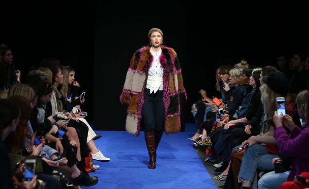 A model presents creations from the Osman collection during a catwalk show on the fourth day of the Autumn/Winter 2017 London Fashion Week in London on February 20, 2017. / AFP / Daniel LEAL-OLIVAS (Photo credit should read DANIEL LEAL-OLIVAS/AFP/Getty Images)