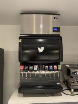 Black soda machine with white Twitter bird logo