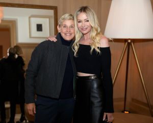 ellen degeneres and portia de rossi standing together in black outfits