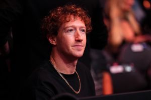 Man pictured in black shirt and gold chain